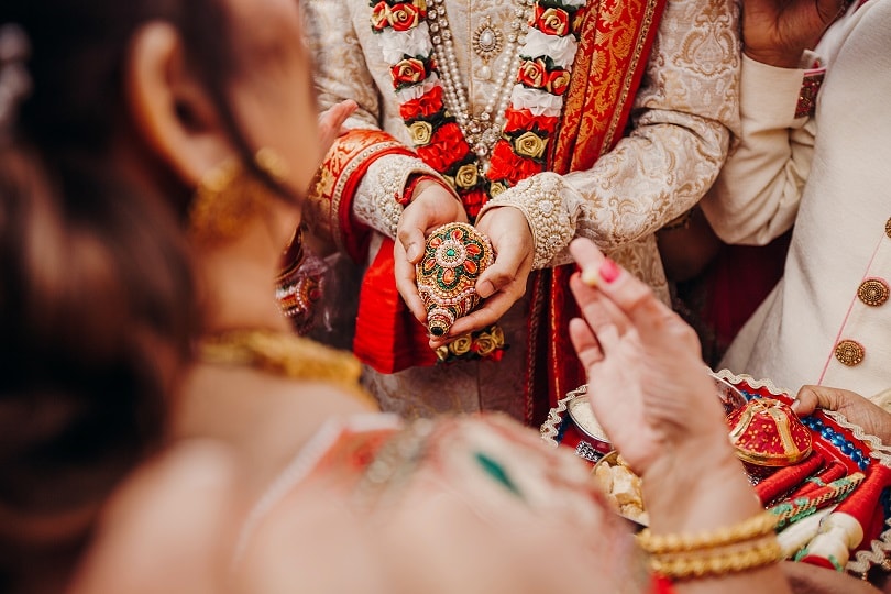 Traditional wedding ritual with garlands